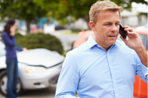 Man Making Phone Call After Accident