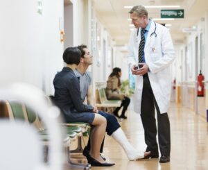 man seeing doctor for work injury