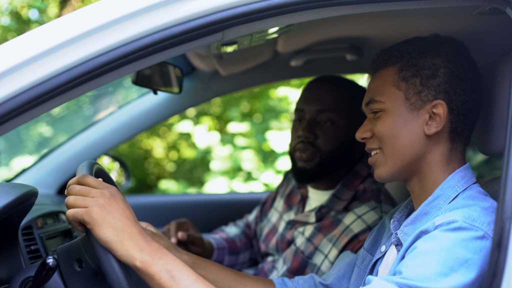 teen receiving driving lesson to avoid accident