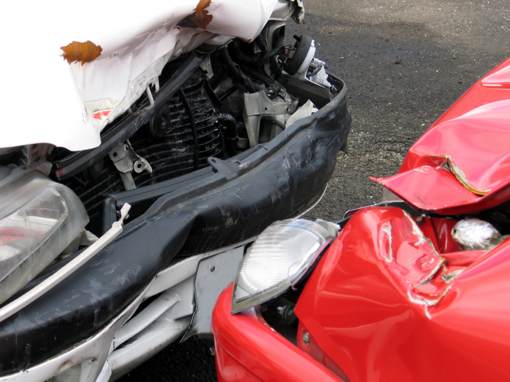 damaged cars involved in head-on collision