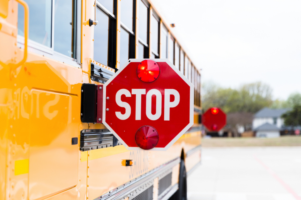 stop-sign-on-bus-with-flashing-red-lights