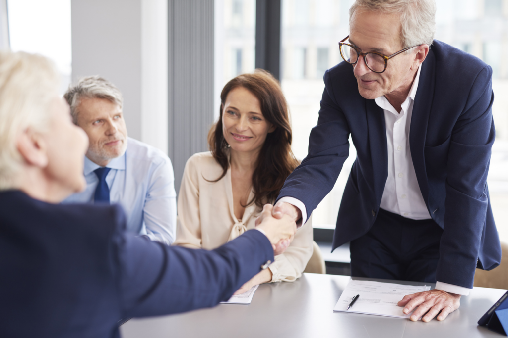 man-and-woman-shaking-hands-after-mediation