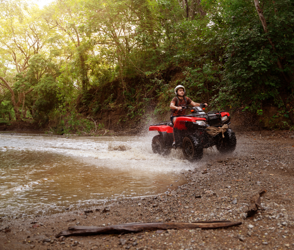 man-riding-ATV-in-SC-woods