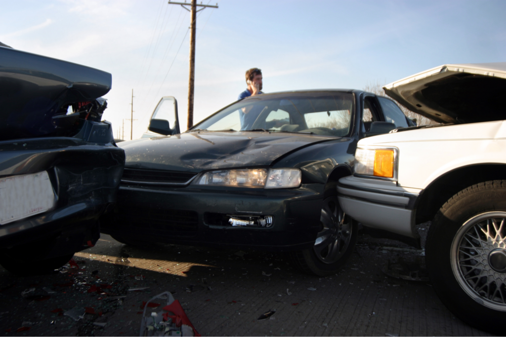 man on cell phone outside multi-vehicle accident in SC