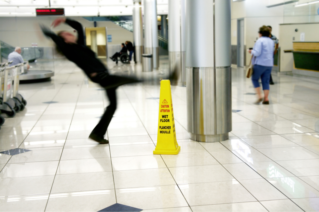 man-slipping-and-falling-at-SC-airport-from-wet-floor