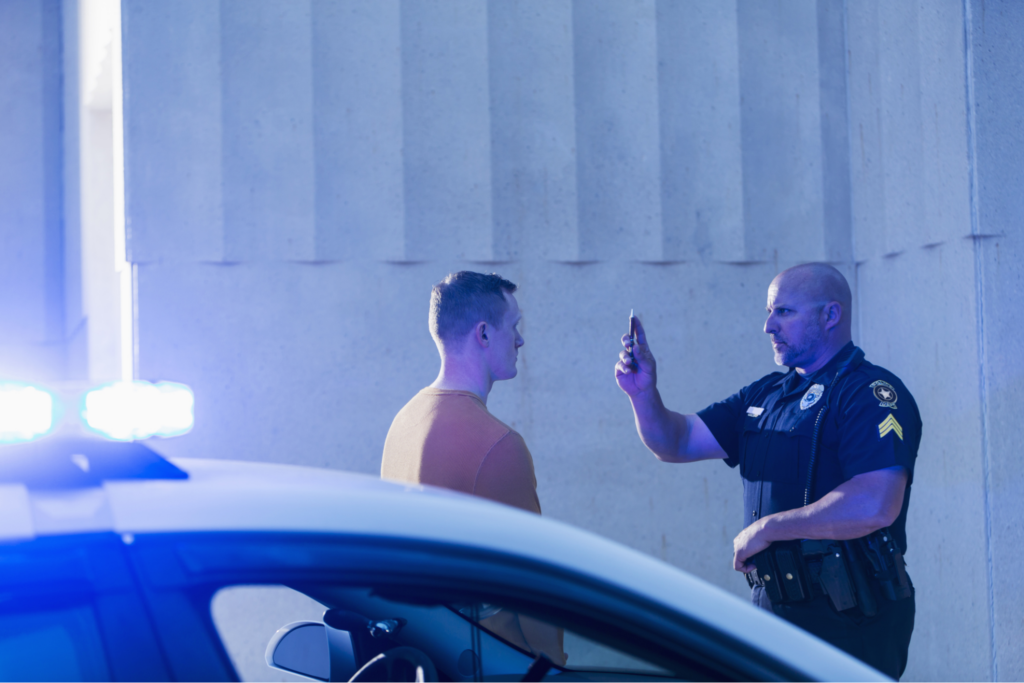 police giving drunk driver sobriety test