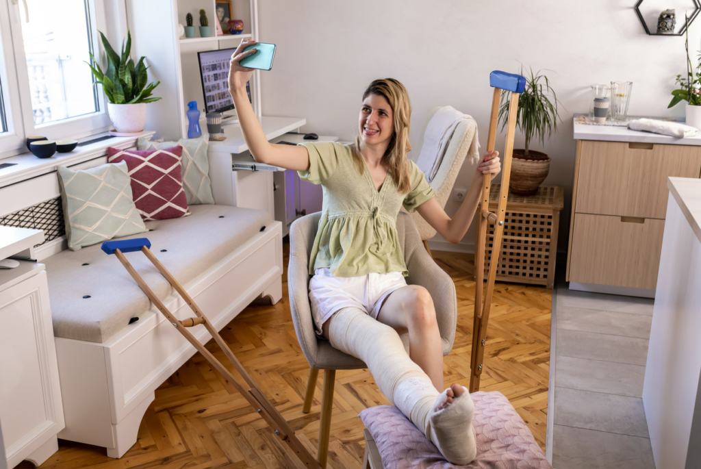 woman-taking-selfie-of-injured-leg-to-share-on-social-media
