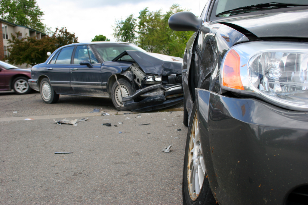 2 smashed cars involved in at fault accident