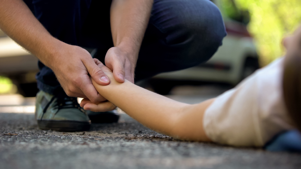 man-holding-womans-hand-that-was-hit-while-jaywalking