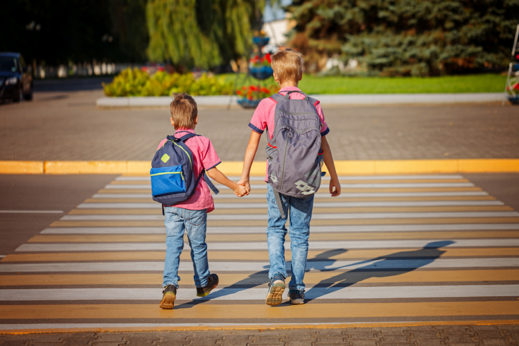 boys-crossing-road-in-crosswalk