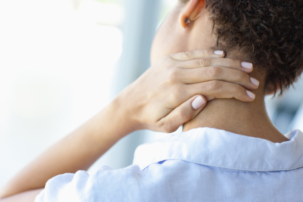 woman-with-whiplash-holding-neck