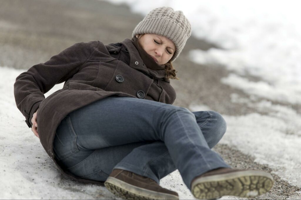 woman-on-ground-after-slipping-on-ice-in-greenville-sc