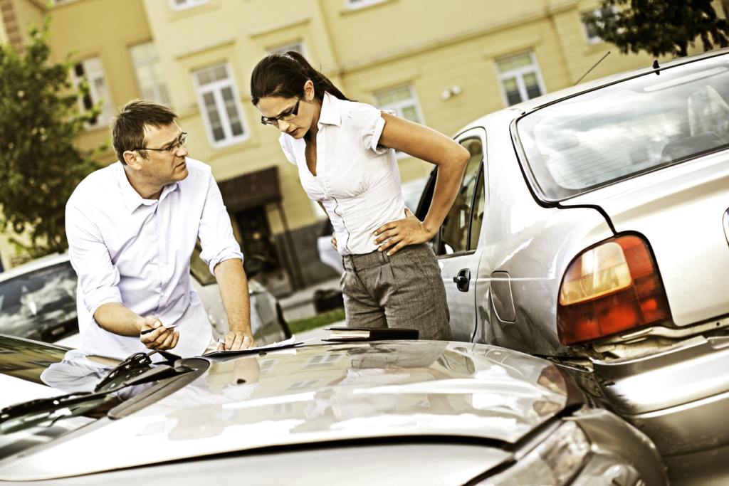 man-and-woman-discussing-parking-lot-accident