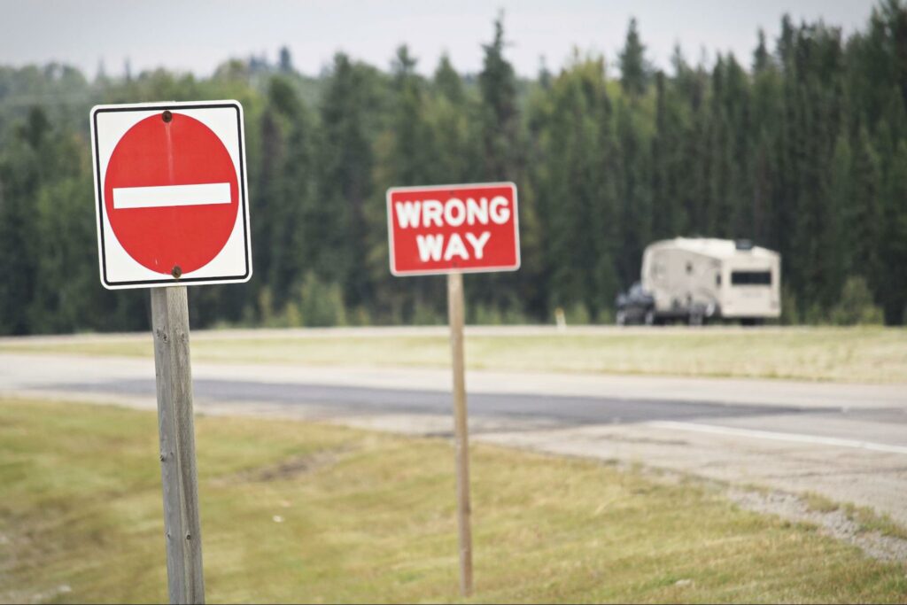 wrong-way-sign-on-side-of-road