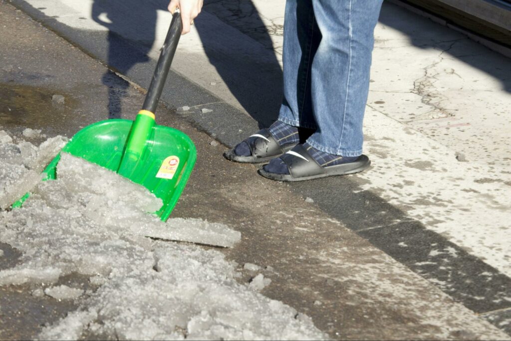 person-shoveling-snow-in-sandals-in-sc