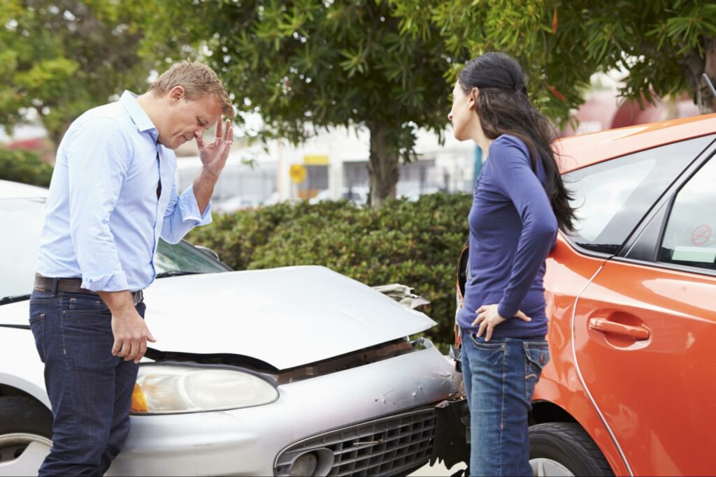 man and woman in rear-end-collision